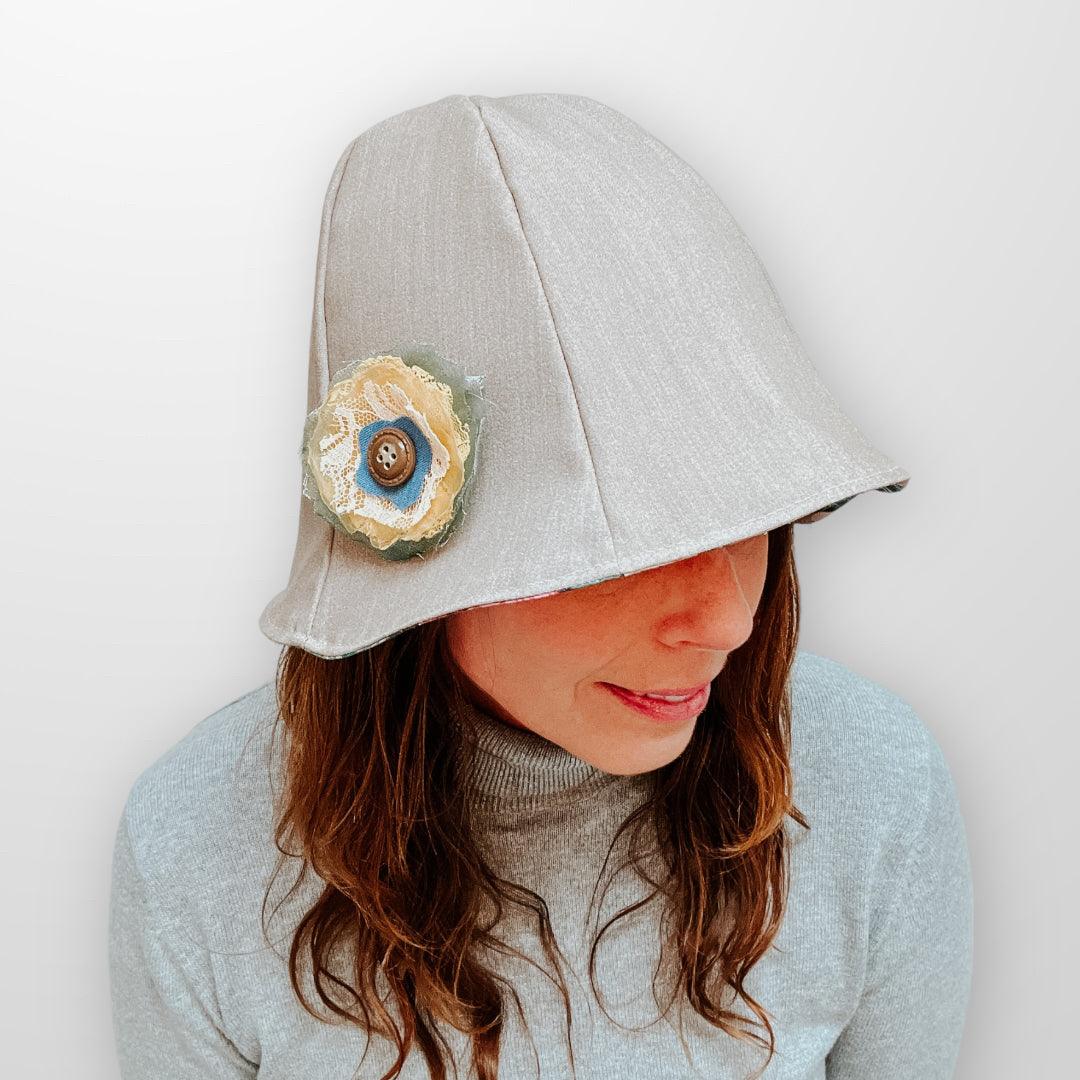Upcycled reversible sun bucket hat with removal scrap fabric flower pin.