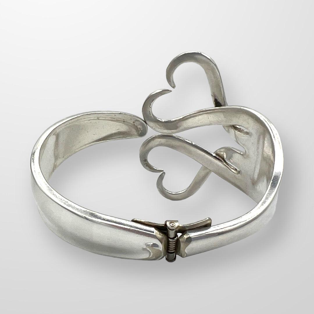 Upcycle Double Heart Fork Bracelet from vintage silver. Size large plated cutlery. Size small.